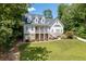 A charming two-story home with a well-manicured lawn and beautiful landscaping, showcasing its inviting curb appeal at 5178 Stefan Ridge Way, Buford, GA 30519