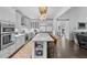 Open kitchen features a large island, stainless steel appliances and breakfast bar at 5178 Stefan Ridge Way, Buford, GA 30519