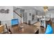 Open-concept kitchen and dining area, featuring stainless steel appliances, quartz countertops, and plenty of seating at 5178 Stefan Ridge Way, Buford, GA 30519