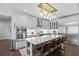 Gourmet kitchen boasts large island, stainless steel appliances, pendant lights and ample cabinet space at 5178 Stefan Ridge Way, Buford, GA 30519