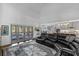 Bright living room and kitchen with vaulted ceiling, doors to patio and large sectional sofa at 5178 Stefan Ridge Way, Buford, GA 30519