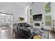 Spacious living room boasts vaulted ceiling, brick fireplace and large windows at 5178 Stefan Ridge Way, Buford, GA 30519