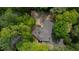 Overhead view of roof and gravel driveway surrounded by lush landscaping at 5251 Powers Ferry Rd, Atlanta, GA 30327