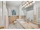Bright bathroom with granite countertops, tiled floors, and shower at 5251 Powers Ferry Rd, Atlanta, GA 30327