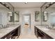 Bathroom featuring dual vanities with granite countertops and modern fixtures at 5251 Powers Ferry Rd, Atlanta, GA 30327