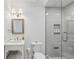 Well-lit bathroom with vanity, modern fixtures, and tiled shower at 5251 Powers Ferry Rd, Atlanta, GA 30327