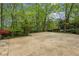 Spacious turn-around driveway with surrounding landscape and tree coverage at 5251 Powers Ferry Rd, Atlanta, GA 30327