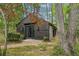 Wood-sided modern home nestled in a wooded area, offering privacy and a natural setting at 5251 Powers Ferry Rd, Atlanta, GA 30327