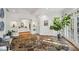 Sunlit foyer with unique stone floors, complemented by views and stylish seating at 5251 Powers Ferry Rd, Atlanta, GA 30327