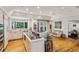 Bright eat-in kitchen with hardwood floors, large windows, and modern countertops at 5251 Powers Ferry Rd, Atlanta, GA 30327