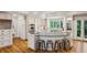 Bright eat-in kitchen with a unique island, stainless steel appliances, and hardwood floors at 5251 Powers Ferry Rd, Atlanta, GA 30327