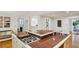 Kitchen island with stainless steel sink and cooktop on red granite countertop at 5251 Powers Ferry Rd, Atlanta, GA 30327