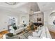 Open-concept living space, showcasing a cozy seating arrangement and arched doorways to other rooms at 5251 Powers Ferry Rd, Atlanta, GA 30327