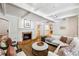 Inviting living room with a marble fireplace and a clear view into the kitchen at 5251 Powers Ferry Rd, Atlanta, GA 30327