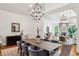 Spacious open-concept design featuring a stone fireplace and hardwood floors at 5251 Powers Ferry Rd, Atlanta, GA 30327