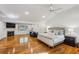 Spacious primary bedroom with hardwood floors, fireplace, and ensuite at 5251 Powers Ferry Rd, Atlanta, GA 30327