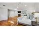 Bright main bedroom with a fireplace, hardwood floors, and an abundance of natural light at 5251 Powers Ferry Rd, Atlanta, GA 30327