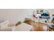 Bright playroom with hardwood floors, a large window, and soft blue modular seating perfect for playtime at 5251 Powers Ferry Rd, Atlanta, GA 30327