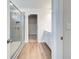 Elegant bathroom features a glass enclosed shower and wood-look vinyl floors at 623 Leafy Branch Way, Mcdonough, GA 30253