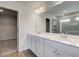 Bathroom showcasing double sink vanity, large mirror and glass shower at 623 Leafy Branch Way, Mcdonough, GA 30253