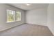 Bright bedroom with neutral carpet and two windows providing plenty of natural light at 623 Leafy Branch Way, Mcdonough, GA 30253