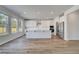 Spacious kitchen features white cabinets, stainless steel appliances, and a large island at 623 Leafy Branch Way, Mcdonough, GA 30253