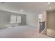 Upstairs loft featuring neutral carpet, natural light, and access to the staircase at 623 Leafy Branch Way, Mcdonough, GA 30253