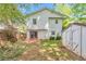 The backyard featuring a shed, patio and grassy area perfect for outdoor activities and relaxation at 912 Third St, Stone Mountain, GA 30083