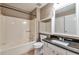 Bathroom with granite countertop vanity, tile flooring, and a tub and shower combination at 912 Third St, Stone Mountain, GA 30083