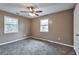 Cozy bedroom featuring plush carpet, neutral color palette and plenty of natural light at 912 Third St, Stone Mountain, GA 30083