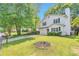 Exterior of a two-story home with a large front yard and driveway, surrounded by lush greenery at 912 Third St, Stone Mountain, GA 30083