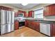 Spacious kitchen equipped with stainless steel appliances, and dark wood cabinets at 912 Third St, Stone Mountain, GA 30083