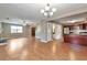 Open-concept living area with hardwood floors, stainless steel appliances, and seamless flow to the kitchen at 912 Third St, Stone Mountain, GA 30083