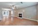 The spacious living room featuring wood floors, a fireplace, and ample natural light through French doors at 912 Third St, Stone Mountain, GA 30083