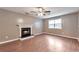 Inviting living room features a classic fireplace, ceiling fan and abundant natural light at 912 Third St, Stone Mountain, GA 30083