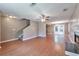 Open-concept living area with wood floors, a fireplace, and seamless transition to the dining area at 912 Third St, Stone Mountain, GA 30083