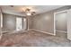 Expansive main bedroom boasts plush carpet, ensuite bathroom and a walk-in closet at 912 Third St, Stone Mountain, GA 30083