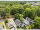 An aerial view of the neighborhood and the home shows the surrounding trees and other homes at 1068 Shelby Se Pl, Atlanta, GA 30316