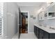 Bright bathroom features a double vanity, hexagon tile floors, and an open doorway to an adjacent room at 1068 Shelby Se Pl, Atlanta, GA 30316
