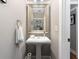 Powder room with a pedestal sink, framed mirror and gray walls at 1068 Shelby Se Pl, Atlanta, GA 30316