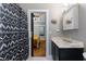 En Suite bathroom features a decorative shower curtain and an open doorway to an adjacent bedroom at 1068 Shelby Se Pl, Atlanta, GA 30316