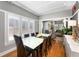 Dining area with shuttered windows offering natural light and hardwood flooring that connects to living area at 1068 Shelby Se Pl, Atlanta, GA 30316