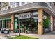 Modern commercial building with expansive windows and inviting signage, showcasing a vibrant and stylish wine shop at 1068 Shelby Se Pl, Atlanta, GA 30316