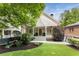 Charming home with a welcoming front porch, manicured lawn, and mature trees at 1068 Shelby Se Pl, Atlanta, GA 30316