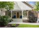 Inviting front porch with chairs and ceiling fans, perfect for relaxing outdoors at 1068 Shelby Se Pl, Atlanta, GA 30316