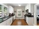 Galley kitchen with stainless steel appliances, granite countertops, and white cabinetry at 1068 Shelby Se Pl, Atlanta, GA 30316