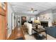 Bright living room featuring hardwood floors, a fireplace, and an open floor plan at 1068 Shelby Se Pl, Atlanta, GA 30316