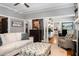 Spacious living room featuring hardwood floors, modern furnishings, and a seamless open layout at 1068 Shelby Se Pl, Atlanta, GA 30316