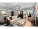 Cozy living room featuring a ceiling fan, an area rug, and a comfortable sofa with an ottoman at 1068 Shelby Se Pl, Atlanta, GA 30316