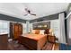 Bedroom with dark gray walls, hardwood floors, ceiling fan and shutters at 1068 Shelby Se Pl, Atlanta, GA 30316